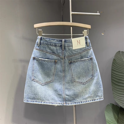 Jupe en jean délavée à la mode pour femme Jupe simple, gracieuse et polyvalente pour les hanches Jupe trapèze de niche