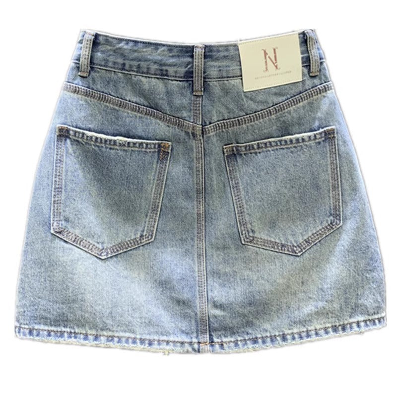 Jupe en jean délavée à la mode pour femme Jupe simple, gracieuse et polyvalente pour les hanches Jupe trapèze de niche